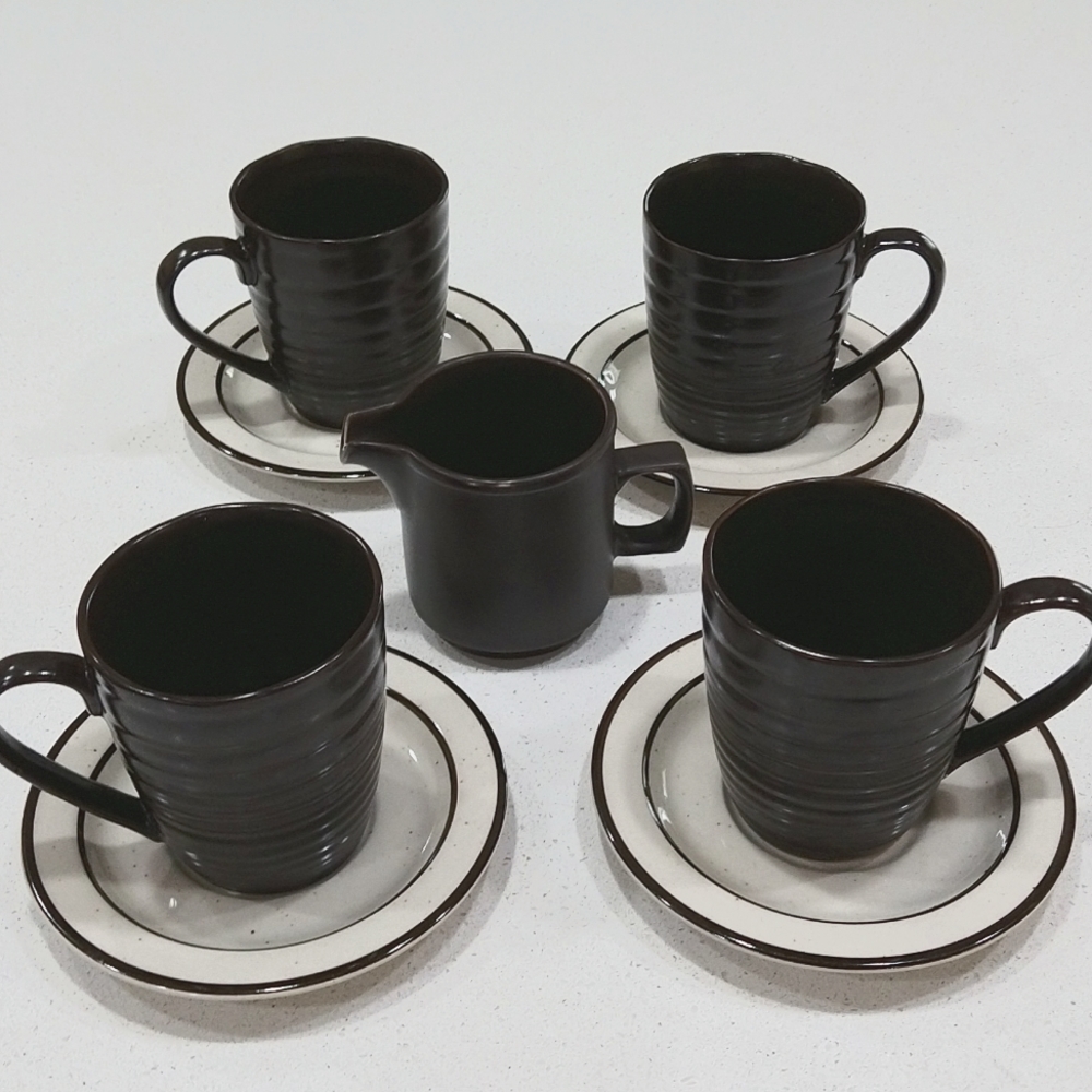 Sango/ swirl charcoal ribbed stoneware mugs with saucers and a creamer